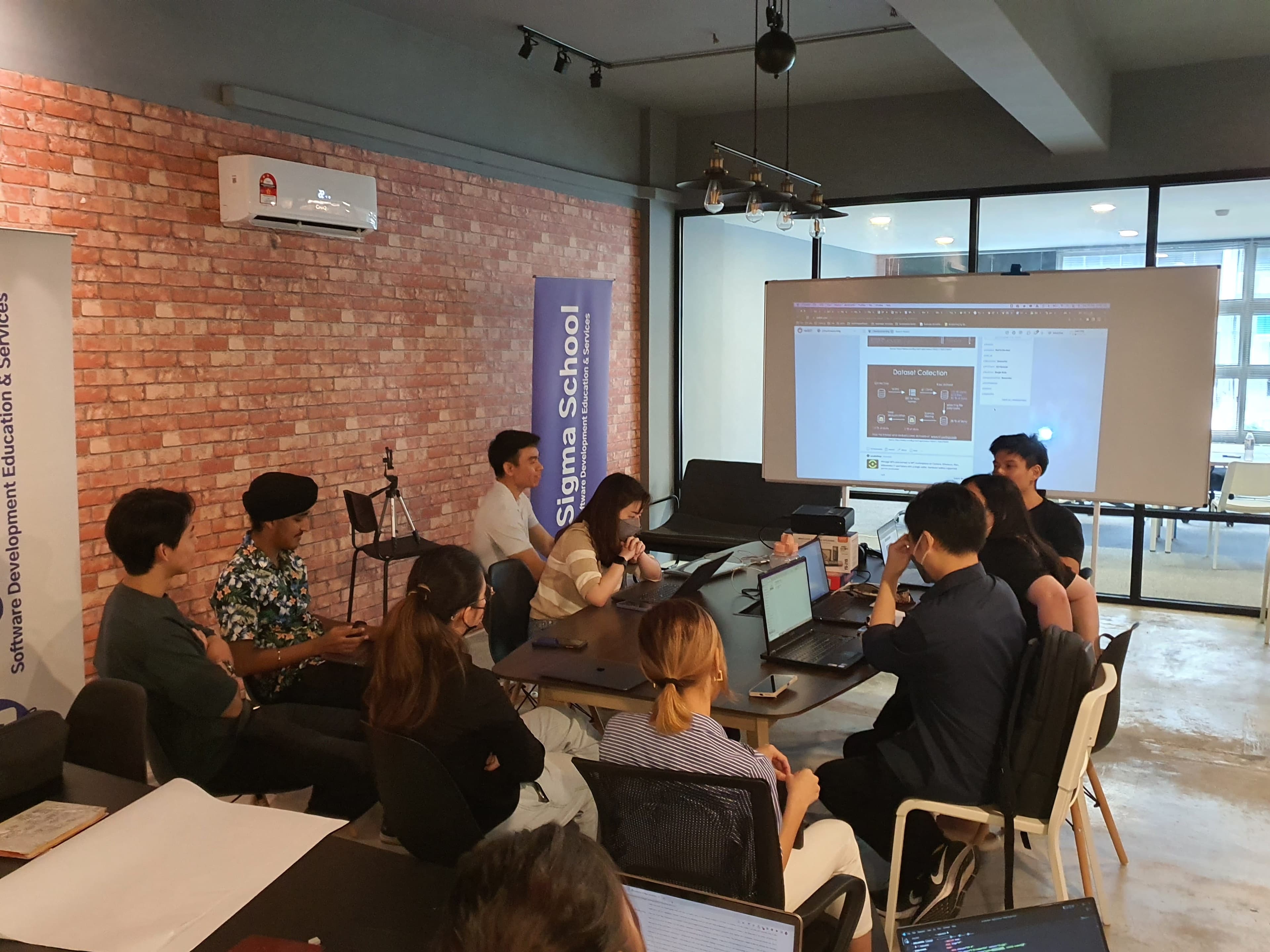 Sigmaschool cohort working from the HustleHub co-learning space